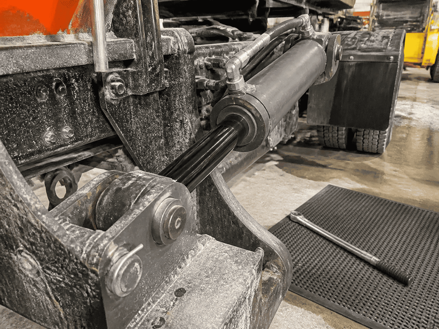 snowplow angle hydraulic cylinder with black QPQ corrosion resistant rod installed on truck chassis